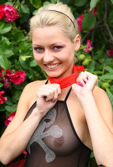 Young blonde Kaira 18 fingers her pussy by the rose bushes in a tutu 44409145