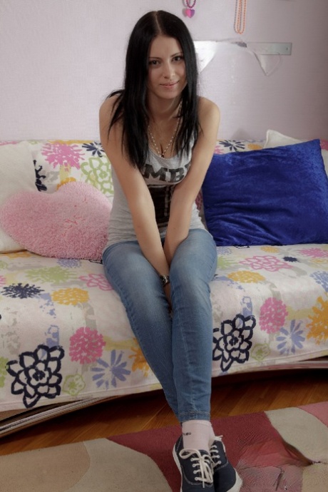 Dark haired teen reads a book prior to having sex with her boyfriend 99298565