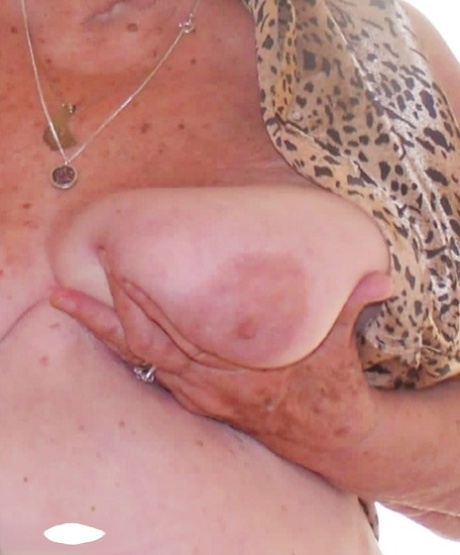 Blonde British granny Grandma Libby fondles her saggy tits during solo action 16006796