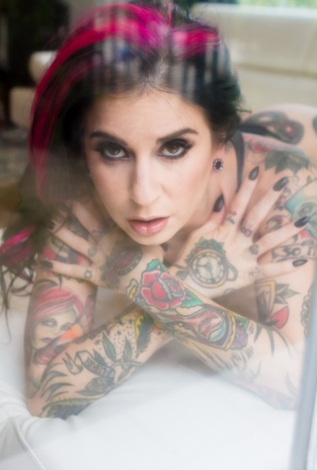 Heavily tattooed model Joanna Angel slips off her sensual black onesie 75556393